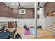 Basement gym features exposed brick walls, multiple ceiling fans, and workout accessories at 65 Peachtree Memorial Nw Dr # 5, Atlanta, GA 30309