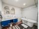 Bright bathroom with double vanity, tiled walls, and modern soaking tub at 65 Peachtree Memorial Nw Dr # 5, Atlanta, GA 30309