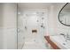 Modern bathroom featuring a glass shower with white subway tile and a floating wood vanity at 65 Peachtree Memorial Nw Dr # 5, Atlanta, GA 30309
