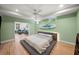 Bright bedroom with light green walls, hardwood floors, a modern platform bed, and connected sitting room at 65 Peachtree Memorial Nw Dr # 5, Atlanta, GA 30309