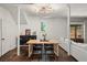 Well-lit dining area with modern light fixture, seating for four, and convenient bar area at 65 Peachtree Memorial Nw Dr # 5, Atlanta, GA 30309