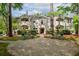 Stunning white-brick exterior with a welcoming stone pathway and elegant landscaping at 65 Peachtree Memorial Nw Dr # 5, Atlanta, GA 30309