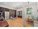 Open kitchen with modern appliances, hardwood floors, and stairs leading to lower level at 65 Peachtree Memorial Nw Dr # 5, Atlanta, GA 30309