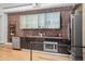 Modern kitchen with stainless steel appliances, brick backsplash, and sleek cabinetry at 65 Peachtree Memorial Nw Dr # 5, Atlanta, GA 30309