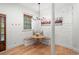 Cozy kitchen nook features built-in seating, hardwood floors, and a modern light fixture at 65 Peachtree Memorial Nw Dr # 5, Atlanta, GA 30309