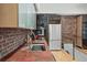 Kitchen featuring stainless steel appliances, copper countertop, and exposed brick accents at 65 Peachtree Memorial Nw Dr # 5, Atlanta, GA 30309