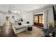 Bright living room with comfortable seating and access to outdoor patio through french doors at 65 Peachtree Memorial Nw Dr # 5, Atlanta, GA 30309