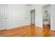 Bright bedroom featuring wood floors and access to an ensuite bathroom, offering both style and functionality at 68 Spence Se Ave, Atlanta, GA 30317