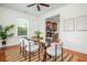 Bright dining room with a glass table and views into the kitchen at 68 Spence Se Ave, Atlanta, GA 30317