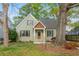 Charming home with a cozy porch and professionally landscaped front yard at 68 Spence Se Ave, Atlanta, GA 30317