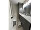 Stylish bathroom featuring gray vanity, granite countertop, and tiled floors at 115 Winding River Dr # B, Atlanta, GA 30350