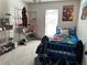 Bedroom featuring carpet, window, and a large poster at 115 Winding River Dr # B, Atlanta, GA 30350