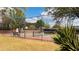 Well-maintained tennis court surrounded by lush landscaping in a gated community at 115 Winding River Dr # B, Atlanta, GA 30350