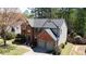 Inviting two-story home with brick facade, well-manicured lawn, and two-car garage at 302 Wickley Way, Woodstock, GA 30188