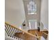 Grand two-story foyer with hardwood floors, large arched window, and elegant chandelier at 302 Wickley Way, Woodstock, GA 30188