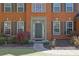 Close-up of a home's front door and entryway, showcasing brick facade and manicured landscaping at 302 Wickley Way, Woodstock, GA 30188