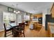 Eat-in kitchen features stainless steel appliances, hardwood floors, and granite countertops at 302 Wickley Way, Woodstock, GA 30188