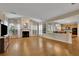 Bright living room features hardwood floors, fireplace and view into the kitchen at 302 Wickley Way, Woodstock, GA 30188