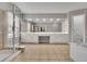 Bright main bathroom featuring an expansive vanity, glass-enclosed shower, and a soaking tub at 302 Wickley Way, Woodstock, GA 30188