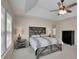 Main bedroom boasts ample sunlight, a ceiling fan, and neutral tones for a relaxing atmosphere at 302 Wickley Way, Woodstock, GA 30188