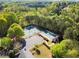 Aerial view showcasing the community's amenities, including tennis courts and parking at 3978 Oak Crossing Drive Dr, Suwanee, GA 30024