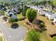 Aerial view of the neighborhood with mature trees and a playground, in a Gathering-friendly area at 3978 Oak Crossing Drive Dr, Suwanee, GA 30024