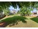 Spacious backyard featuring lush green grass, mature trees, and a well-maintained fence at 3978 Oak Crossing Drive Dr, Suwanee, GA 30024
