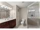 Updated bathroom with a glass-enclosed shower, modern fixtures, and neutral tones at 3978 Oak Crossing Drive Dr, Suwanee, GA 30024