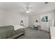 Neutral-toned bedroom with a bed, desk, and great natural light at 3978 Oak Crossing Drive Dr, Suwanee, GA 30024