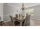 Formal dining room featuring neutral walls, wood floors, and natural light for an inviting atmosphere at 3978 Oak Crossing Drive Dr, Suwanee, GA 30024