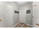 Entryway with multiple doors, wood-look flooring, and neutral decor at 3978 Oak Crossing Drive Dr, Suwanee, GA 30024