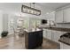 Open concept kitchen with stainless steel appliances, granite countertops, island, and adjacent breakfast area at 3978 Oak Crossing Drive Dr, Suwanee, GA 30024
