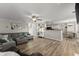 Bright living area with hardwood floors, an open layout, and a comfortable sectional, ideal for modern living at 3978 Oak Crossing Drive Dr, Suwanee, GA 30024
