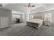 Spacious main bedroom features tray ceilings, neutral decor and space for a desk at 3978 Oak Crossing Drive Dr, Suwanee, GA 30024