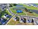 This overhead shot reveals a property nestled in a community with a pond, walking paths, and tennis courts at 4409 Encore Park Lane, Duluth, GA 30097