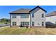 Open backyard featuring a patio and expansive green space at 4409 Encore Park Lane, Duluth, GA 30097