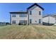 Spacious backyard with a well-maintained lawn and patio area for outdoor living and entertaining at 4409 Encore Park Lane, Duluth, GA 30097