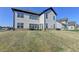 Spacious backyard with a well-maintained lawn and patio area for outdoor living and entertaining at 4409 Encore Park Lane, Duluth, GA 30097