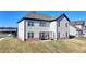 Large backyard featuring a patio area, ideal for gatherings and outdoor enjoyment at 4409 Encore Park Lane, Duluth, GA 30097