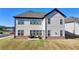 Expansive backyard with a patio, offering ample space for relaxation and entertainment at 4409 Encore Park Lane, Duluth, GA 30097