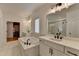 A spacious bathroom features a dual sink vanity, a soaking tub, and a glass-enclosed shower at 4409 Encore Park Lane, Duluth, GA 30097