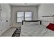 Comfortable bedroom with large window, plush bed, and a neutral palette offering a serene retreat at 4409 Encore Park Lane, Duluth, GA 30097