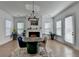 Well-lit dining space featuring a round table, stylish chairs, and a fireplace, perfect for intimate gatherings at 4409 Encore Park Lane, Duluth, GA 30097