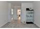 Inviting hallway with neutral carpet, white walls, and visible doorways to bathroom and staircase for easy navigation at 4409 Encore Park Lane, Duluth, GA 30097