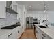Modern kitchen with stainless steel appliances, sleek countertops, and stylish backsplash at 4409 Encore Park Lane, Duluth, GA 30097