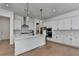 Stylish kitchen with a large island, stainless steel appliances, and ample cabinet space at 4409 Encore Park Lane, Duluth, GA 30097