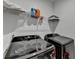 Well-equipped laundry room with modern washer and dryer, plus ample storage space above at 4409 Encore Park Lane, Duluth, GA 30097