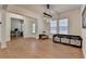 Bright living room featuring hardwood floors, large windows, and a modern light fixture at 4409 Encore Park Lane, Duluth, GA 30097