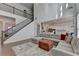 Spacious living room featuring a staircase, hardwood floors, and open layout at 4409 Encore Park Lane, Duluth, GA 30097