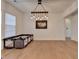 Airy living room showcasing gleaming hardwood floors, neutral walls, and contemporary light fixtures at 4409 Encore Park Lane, Duluth, GA 30097